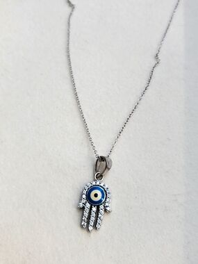 Sterling Silver Hamsa Hand Necklace with Blue Evil Eye Pendant